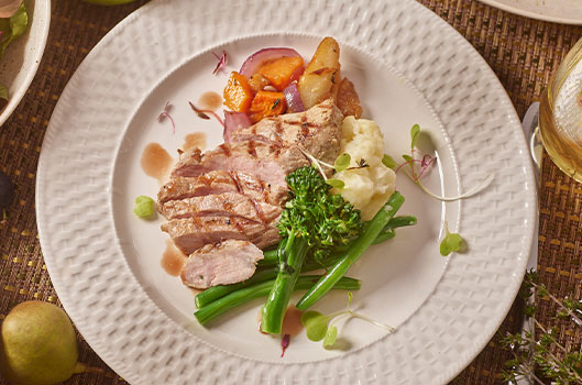 Grilled Ib&eacute;rico Pork Chops with Cider-Braised Apples and Vegetables