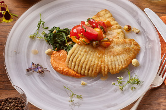 Pan-Roasted Skate with Romesco, Heirloom Tomatoes, and Olives